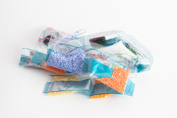 Bags with beads of different colors for Collecting diamond paint. Set of plastic bags with glass beads