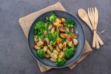 healthy home made roasted italian gnocchi with bacon and broccoli