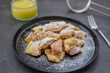 Austrian cuisine. Torn pancake (or omelet) kaiserschmarrn with honey, powdered sugar