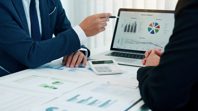 Group of business people analysis summary graph reports of business operating expenses and work data about the company's financial statements.