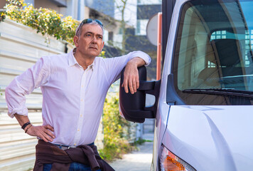 trucker or carrier with his van ready for delivery