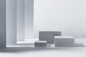 White square podiums in sunlight with shadow in white geometric perspective space. Showcase for cosmetic products, goods, shoes, bags, watches.