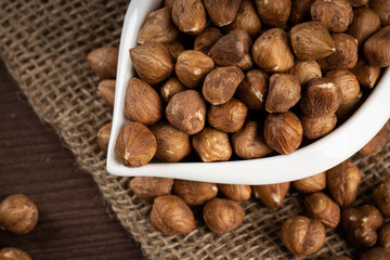 Close up peeled hazelnuts in bowl