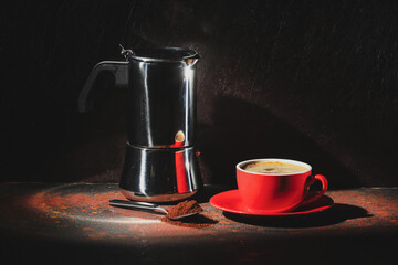 Cup with hot coffee on dark background