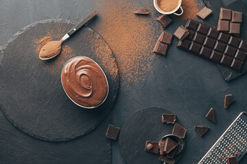 Composition with tasty melted chocolate on dark background