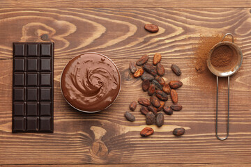 Obraz na płótnie Canvas Composition with different chocolate on wooden background