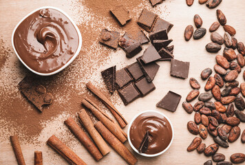 Composition with different chocolate on wooden background