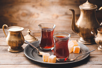 Composition with hot Turkish tea on wooden background