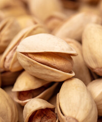 Close-up of fresh pistachio nuts as background.