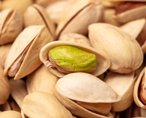 Close-up of fresh pistachio nuts as background.