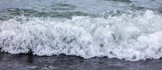 Wave in the sea with splashing water.