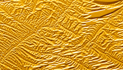 Gold patterns from frost on glass as a background.