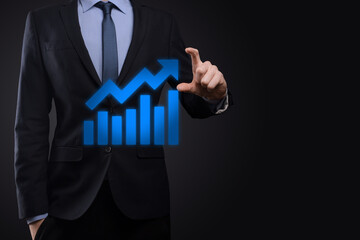 Businessman hold drawing on screen growing graph, arrow of positive growth icon.pointing at creative business chart with upward arrows.Financial, business growth concept