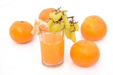 the healthy orange juice with green ripe grape , isolated on white background.