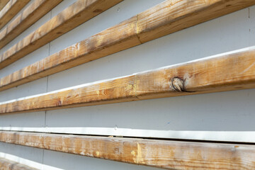 Natural wood boards on the outer wall of a country house