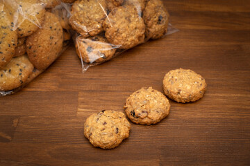 Homemade oatmeal cookies on a wooden table background. Healthy Eating Snack Concept /