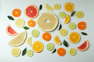Flat lay with citrus slices on white background