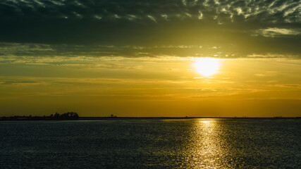 Obraz premium Grado and its lagoon at sunset. Glimpses of tranquility.