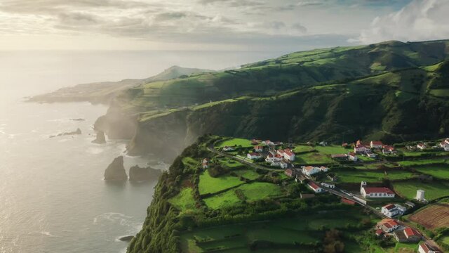 Casa do Gato Tomas, Flores Island, Azores, Portugal. Aerial view of a small village in the heart of a lush valley. The wildest and most remote area of the Azores Islands. High quality 4k footage