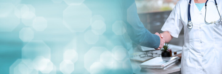 Handshake between doctor and patient; panoramic banner