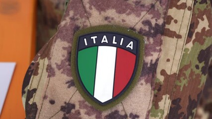 Europe, Italy , Milan March 2021 - 
vaccination with Astazeneca vaccine against Covid-19 Coronavirus continues - italian flag stamp on military uniform of the  army - Powered by Adobe