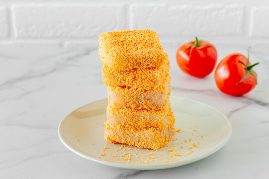 Breaded Fish Patties On A Plate Prepared To Cook