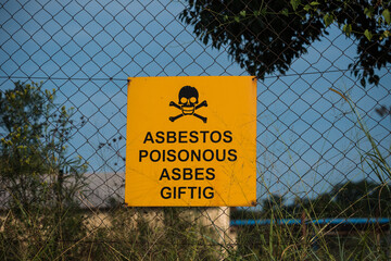 Asbestos poisonous sign in English and Afrikaans in North West, South Africa.