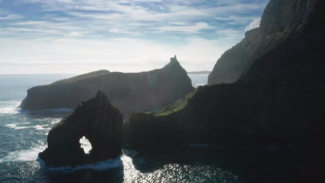 Casa do Gato Tomas, Flores Island, Azores, Portugal. Aerial footage of isolated picturesque bay during sunrise. Fascinating mountain range washed by the ocean. High quality 4k footage