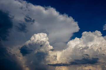 Cumulus clouds in a blue sky.