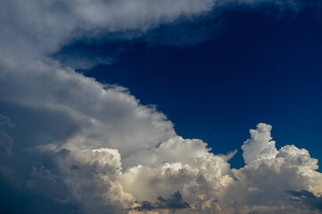 Cumulus clouds in a blue sky.