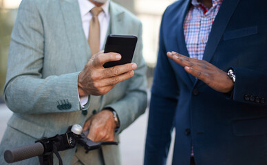 Business men standing on street and using smart phone.