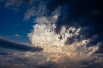 Cumulus clouds in a blue sky.