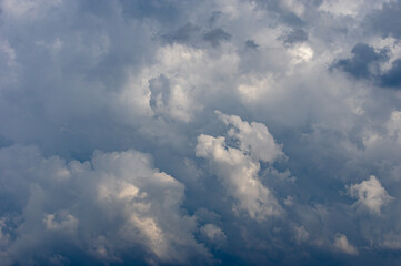 Cumulus clouds in a blue sky.