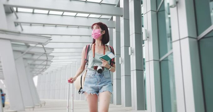 Asian female traveler walking