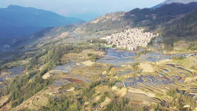 aerial video of the beautiful yuanyang hani terraced fields and small towns, yunnan province, China.