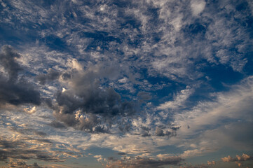 Cumulus clouds in a blue sky.