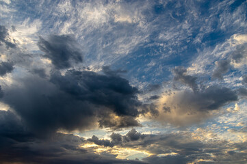 Cumulus clouds in a blue sky.