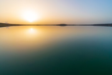 Beautiful sunset at the St&ouml;rmthaler lake with a calm water surface
