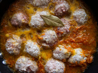 hot freshly made meatballs with vegetable sauce