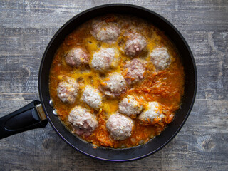 hot freshly made meatballs with vegetable sauce