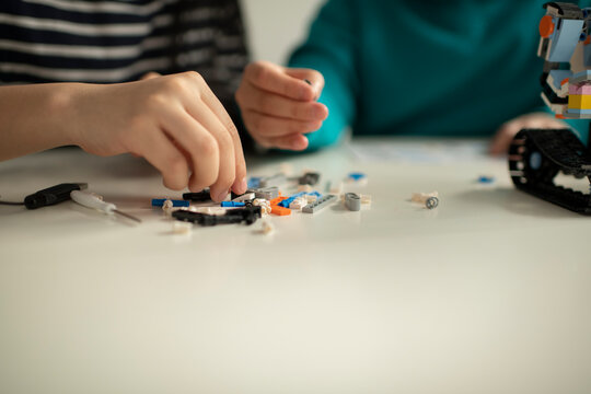 Elementary School Students Assembling Programming Robot