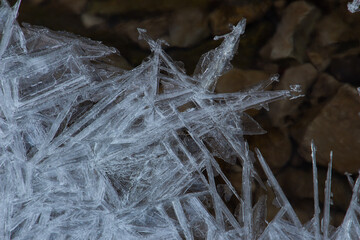 Ice spike crystal structure over rocks