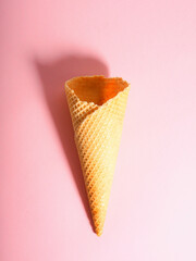 Empty ice cream waffle cup, cone cone on pink background