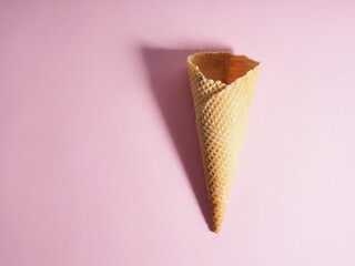 Empty ice cream waffle cup, cone cone on pink background