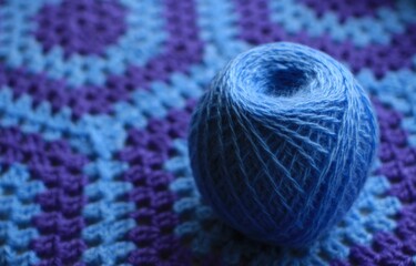 Plaid crocheted from blue and lilac threads