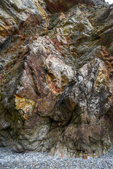 .Colorful rock rock texture, geological phenomenon in the rocks above the atlantic ocean.