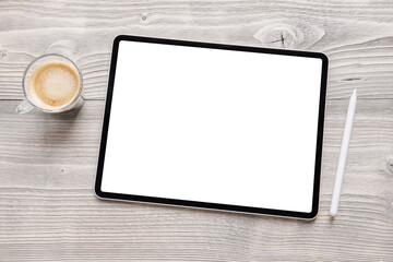 Tablet mockup with empty white screen and wireless stylus pen on table