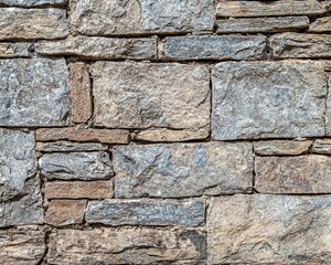 grey stone wall closeup, textured pattern natural background