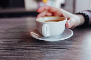 Hands man with coffee.