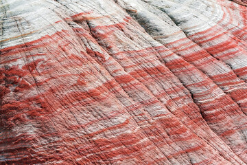 Colorful patterns on the slopes of red mountains